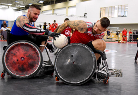 The 39th National Veterans Wheelchair Games kicked off in Louisville, Ky., today with a hard fought game of quad rugby. Chris Hull, left; and Mason Symons, right, put up a great battle that culminated in the Red Team winning 13-12.